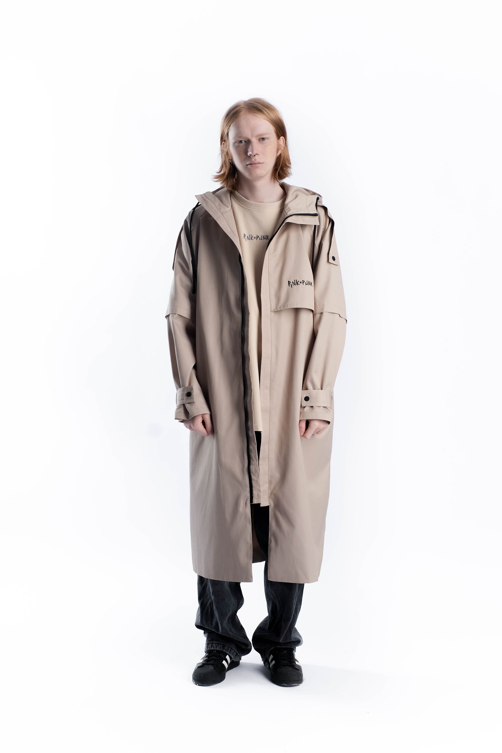<p>PinkPunk designer trench coat. It is specially designed so that you don't look like everyone else in spring and autumn. It features a stylish asymmetrical yoke, high-quality hardware, adjustable sleeve width, and a hood.</p><p>Composition: 80% cotton 20% polyester</p><p>Lining composition: 45% cotton 55% polyester</p>