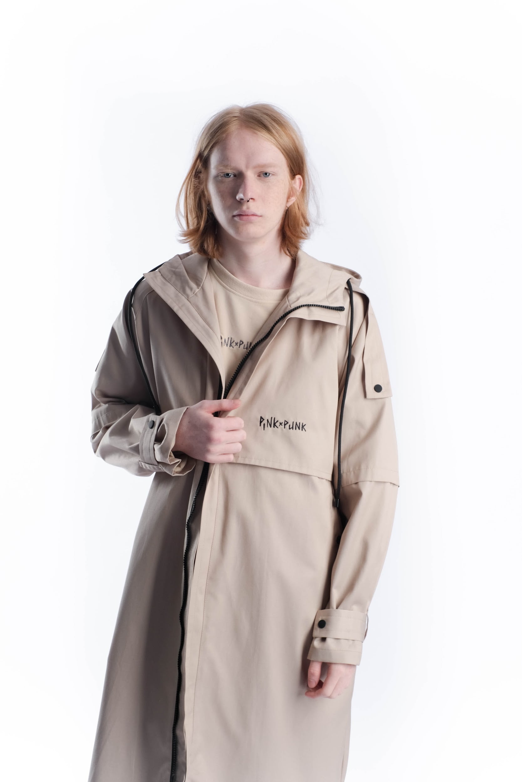 <p>PinkPunk designer trench coat. It is specially designed so that you don't look like everyone else in spring and autumn. It features a stylish asymmetrical yoke, high-quality hardware, adjustable sleeve width, and a hood.</p><p>Composition: 80% cotton 20% polyester</p><p>Lining composition: 45% cotton 55% polyester</p>